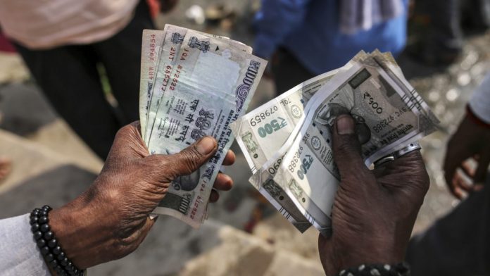Rupee falls to 75 for first time, stocks continue to drop as foreigners pull out $10 bn