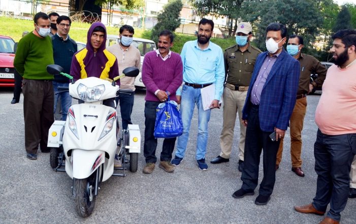 Div Com distributes scooty to specially abled