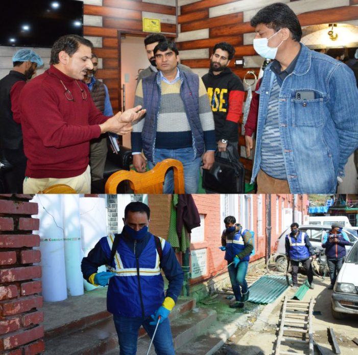 Municipality Budgam disinfects hospitals, crowded places