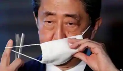 Japan lifts virus state of emergency in most regions: PM Abe