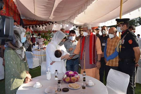 Lt Governor Sinha meets family members of Waseem Bari and Sajad Ahmad Khandey