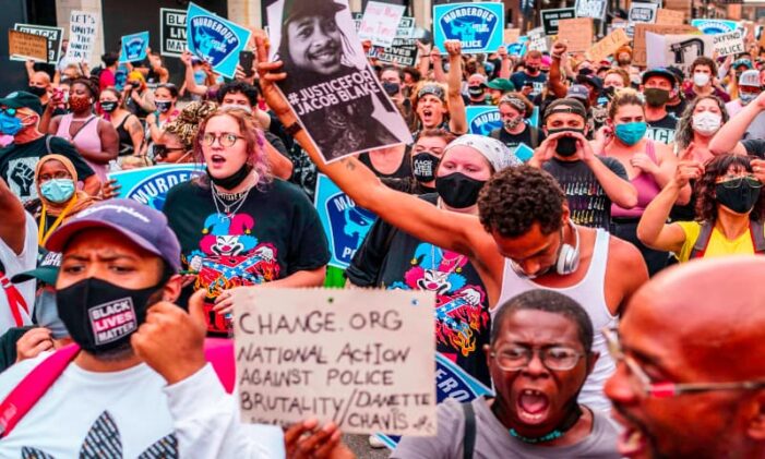US police shoot black man in back, sparking unrest