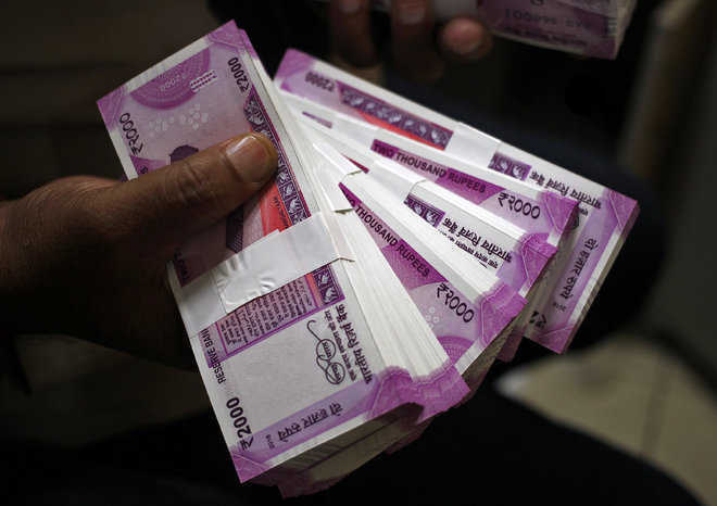 Rupee slips 15 paise to 74.70 against US dollar in early trade