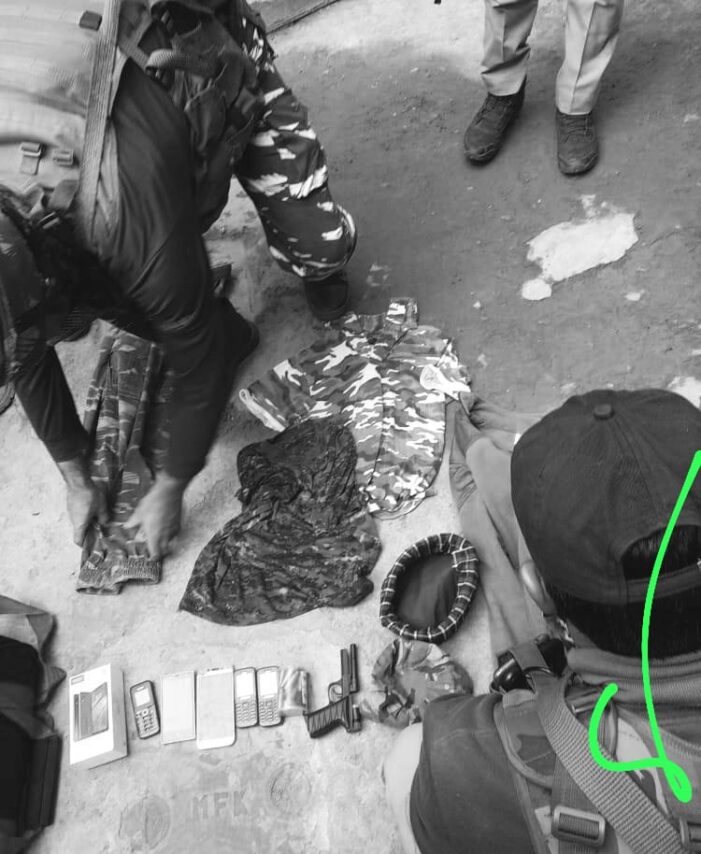 Police recover military uniforms and cell phones during a raid Police recover military uniforms and cell phones during a raid