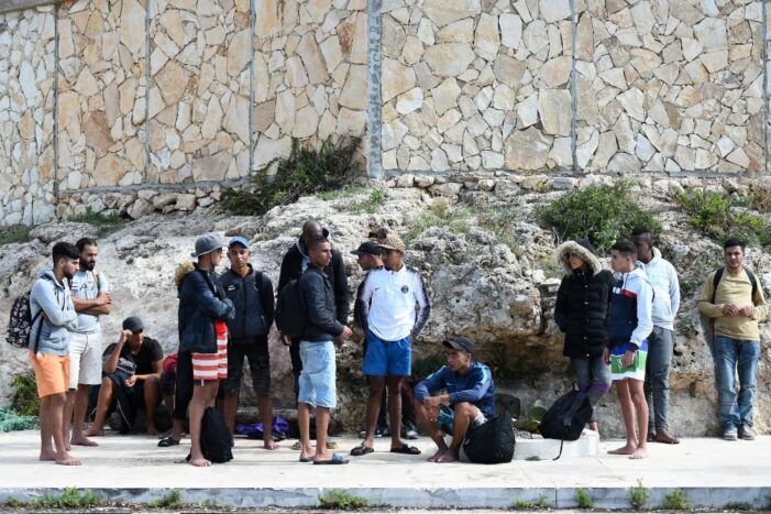 Over 1,000 migrants land in Italy, spark tension