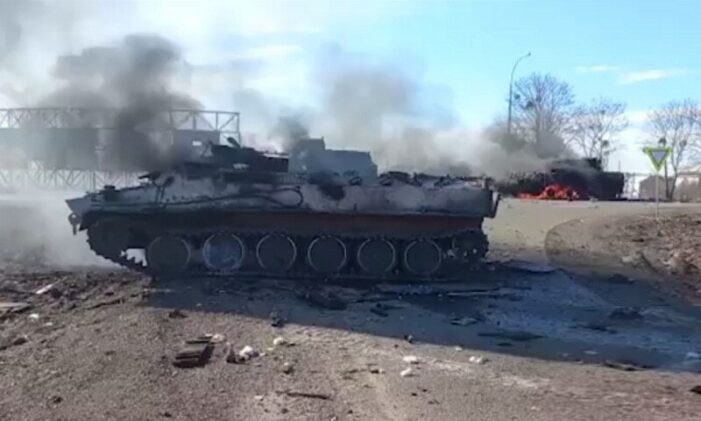 Russia presses invasion to outskirts of Ukrainian capital as US imposes new sanctions
