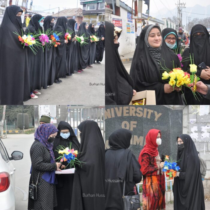 Hijab-clad students offered flowers by ladies outside University of Kashmir