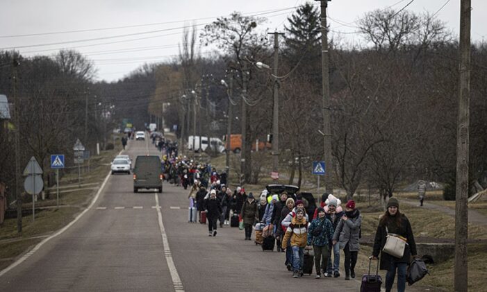 Ukrainians flee encircled cities as refugees top two million