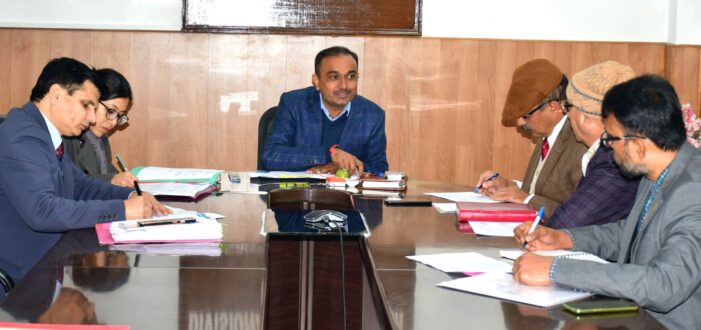 Div Com Jammu reviews progress on PMDP road projects being executed in districts