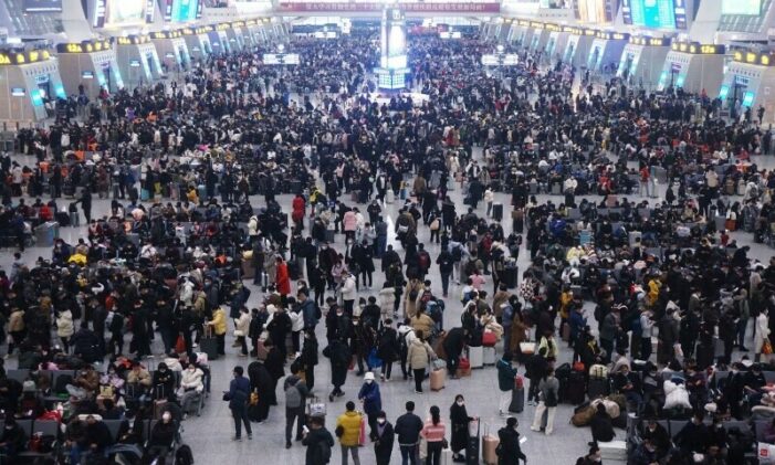 China plays down Covid outbreak with holiday rush at full tilt